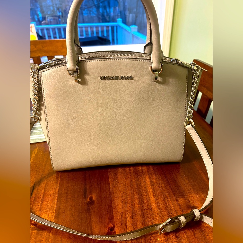 Grey Michael Kors handle purse comes with adjustable shoulder strap